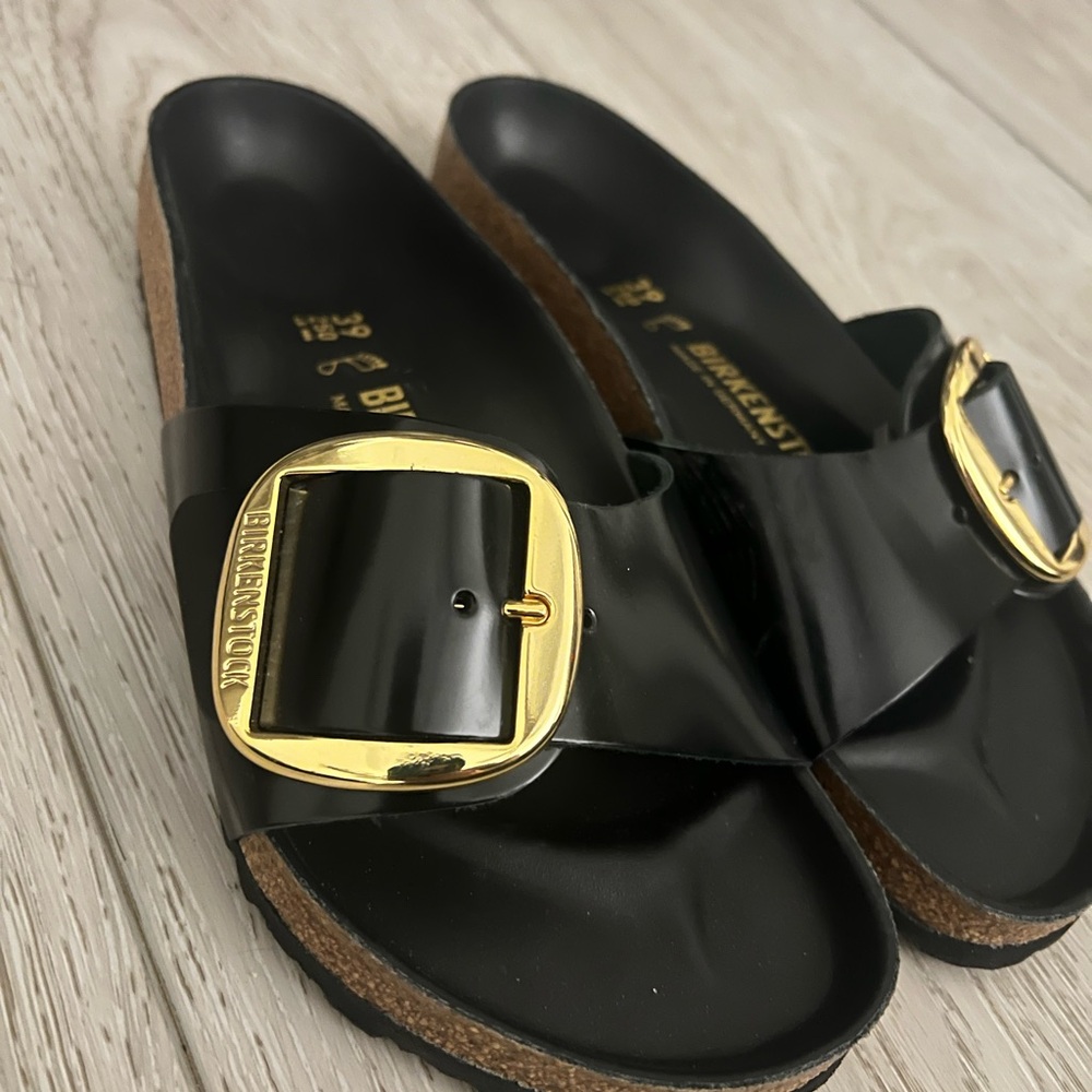 Birkenstock Black and Gold Sandals with Sleek Design